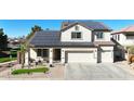 Beautiful two-story home showcasing solar panels, desert landscaping, and a welcoming entrance at 10322 W Edgemont Dr, Avondale, AZ 85392