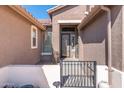 Welcoming front entrance with an iron gate and a charming welcome sign at 10722 E Keats Ave, Mesa, AZ 85209