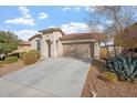 Attractive one-story home featuring a 2-car garage and well-kept front yard landscaping at 11554 W Lone Tree Trl, Peoria, AZ 85383