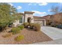 Inviting single-story home featuring a two-car garage and tidy desert landscaping at 11554 W Lone Tree Trl, Peoria, AZ 85383