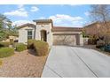 Charming single-story home with a two-car garage and well-maintained front yard landscaping at 11554 W Lone Tree Trl, Peoria, AZ 85383