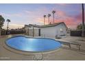 Refreshing backyard pool with diving board perfect for warm days and outdoor entertaining at 1716 W Butler Dr, Phoenix, AZ 85021