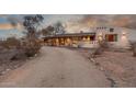 Inviting single-story home with a gravel driveway and desert landscaping at 2107 N Campo Allegre Dr, Tempe, AZ 85288