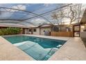 Private swimming pool with a screened enclosure, perfect for year-round enjoyment at 2107 N Campo Allegre Dr, Tempe, AZ 85288