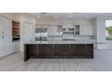 Modern eat-in kitchen featuring stainless steel appliances and custom cabinetry at 24548 N 121St Pl, Scottsdale, AZ 85255