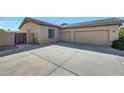 Spacious three-car garage with an extra wide driveway offers ample parking at 3531 E Norwood Cir, Mesa, AZ 85213