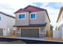 Charming two-story home featuring an attached two-car garage, manicured landscaping, and neutral exterior paint at 482 S Soho Ln # 3, Chandler, AZ 85225