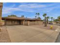 Inviting home with a spacious covered carport and desert landscaping at 915 S Saranac Ave, Mesa, AZ 85208