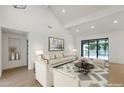 Spacious living room boasting vaulted ceilings and ample natural light from sliding glass doors at 10360 N 98Th St, Scottsdale, AZ 85258