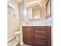 Cozy bathroom with a dark wood vanity and a standard toilet at 111 S Greenfield Rd -- # 462, Mesa, AZ 85206