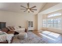 Bright living area with large window, comfortable seating, and a vaulted ceiling at 1446 E Oxford Ln, Gilbert, AZ 85295