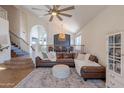 Open living room with cozy seating, high ceilings, and natural light at 1446 E Oxford Ln, Gilbert, AZ 85295