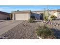 Charming single-story home featuring a two-car garage and desert landscaping at 16546 E Ashbrook Dr # A, Fountain Hills, AZ 85268