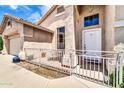 Attractive home featuring a front porch, a two-car garage, and desert landscaping at 17620 W Weatherby Dr, Surprise, AZ 85374