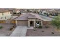 Charming single-story home with stone accents, a covered porch, and well-maintained landscaping at 18465 W Fulton St, Goodyear, AZ 85338