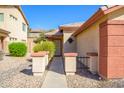 Inviting front entrance with a walkway leading to the front door and well-maintained desert landscaping at 23836 W Jefferson St, Buckeye, AZ 85396