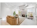 Bright living room featuring tile floors, recessed lighting, and a fireplace at 2514 E Montebello Ave, Phoenix, AZ 85016