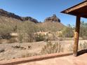 Desert view from porch features mountains and sparse vegetation at 27575 N Dolores Pl, San Tan Valley, AZ 85144