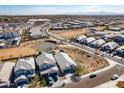 Aerial view of a desert community featuring single Gathering homes and desert landscaping at 3029 S 78Th Dr, Phoenix, AZ 85043