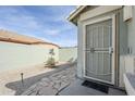 Inviting front entrance with a security screen door and stone pathway at 39935 N Passaro Dr, San Tan Valley, AZ 85140