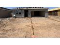 Under construction exterior showing a single story home with garage and desert landscaping at 46886 W Old Timer Rd, Maricopa, AZ 85139