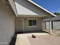 Front porch with security door provides a welcoming entry to the property, with desert landscaping at 614 W 7Th Ave, Mesa, AZ 85210