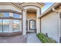 Welcoming front entrance with covered porch, desert landscaping, and charming exterior details at 835 W Beechnut Dr, Chandler, AZ 85248