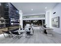 Open-concept living room with high ceilings and a wall of windows to the exterior at 11578 N 80Th Pl, Scottsdale, AZ 85260