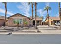 Inviting single-story home with low maintenance desert landscaping and concrete driveway at 11844 N 146Th Ave, Surprise, AZ 85379