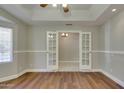 Spacious bonus room with wood floors, large window, and bright white trim at 1331 E Bates St, Mesa, AZ 85203