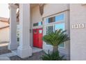 Close-up of a red double-door entrance with striking pillars and desert landscaping creating a welcoming facade at 1915 E Citation Ln, Tempe, AZ 85284