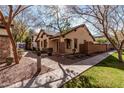 Attractive home with stone detailing, neat landscaping, and welcoming pathway at 2454 E Vermont Dr, Gilbert, AZ 85295