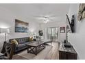Cozy living room with modern decor, stylish furniture, and wood-look tile flooring at 2511 W Queen Creek Rd # 323, Chandler, AZ 85248