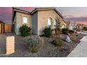 Well-maintained home with desert landscaping, arched windows, and a neutral color scheme at 26199 S 227Th St, Queen Creek, AZ 85142
