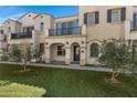 Inviting townhome exterior boasts a balcony, covered entry, and well-maintained landscaping at 4020 E Toledo St # 103, Gilbert, AZ 85295