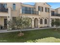 Attractive townhome showcases a balcony, welcoming entrance, and lush green space at 4020 E Toledo St # 103, Gilbert, AZ 85295