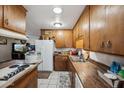 Vintage kitchen features tiled floor, wood countertops and cabinets, and a functional layout at 4020 W Tuckey Ln, Phoenix, AZ 85019