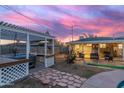 Inviting backyard with a covered patio, hot tub, and a pergola, ideal for outdoor entertaining and relaxation at 4245 N 16Th Dr, Phoenix, AZ 85015