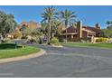 A street view showcasing the community landscaping and distant mountain views at 4434 E Camelback Rd # 132, Phoenix, AZ 85018
