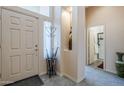 Warm and welcoming foyer featuring neutral tones, tiled floors and an umbrella stand at 6620 S Front Nine Dr, Gold Canyon, AZ 85118