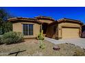 Charming single-story home featuring a desert-landscaped yard and a terracotta-tiled roof at 6620 S Front Nine Dr, Gold Canyon, AZ 85118
