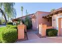 Inviting single-story home with neatly trimmed landscaping and a brick-lined walkway at 8138 E Via De La Escuela --, Scottsdale, AZ 85258