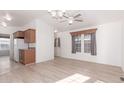 Open living area featuring hardwood floors, natural light and a kitchen view at 8865 E Baseline Rd # 1731, Mesa, AZ 85209