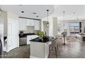 Bright kitchen with stainless appliances, granite countertops, island and dining area at 945 E Playa Del Norte Dr # 5005, Tempe, AZ 85288