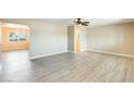 Bright living room with new light grey vinyl flooring and ample space for seating and decor at 10025 W Alabama Ave, Sun City, AZ 85351