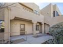 A modern condo exterior offers a private entrance and desert landscaping at 11011 N Zephyr Dr # 106, Fountain Hills, AZ 85268