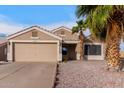 Charming single-story home with a two car garage, desert landscaping and a mature palm tree at 11178 W Echo Ln, Peoria, AZ 85345