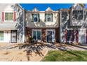 Two-story townhome featuring a well maintained yard, brick facade, and easy-to-access front entrance at 1600 N Saba St # 191, Chandler, AZ 85225