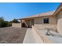 Inviting front entrance features a quaint patio area and a nicely landscaped yard at 1612 Leisure World --, Mesa, AZ 85206