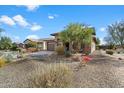 The property features desert landscaping and a paved driveway leading to the garage and covered entryway at 17963 E Silver Sage Ln, Rio Verde, AZ 85263